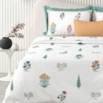 Tailor bird printed bedsheet on king-size bed
