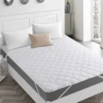 Quilted waterproof mattress pad with 100gsm padding