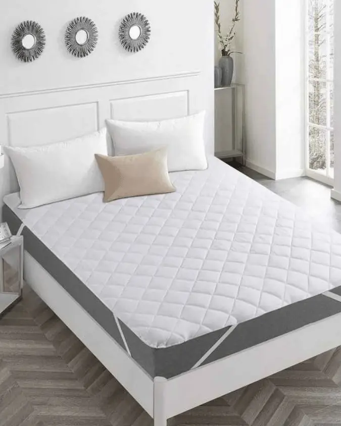 Quilted waterproof mattress pad with 100gsm padding