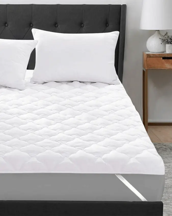 100gsm micro fabric mattress pad on bed