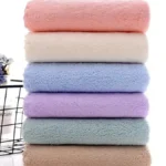 White 650 GSM hotel premium bath towel neatly folded